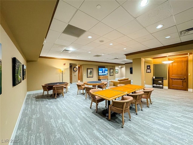 dining space featuring carpet floors and crown molding