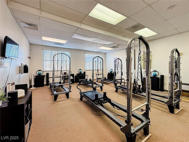 exercise room with a drop ceiling