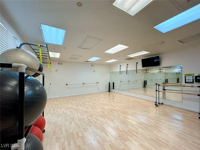 workout room featuring light hardwood / wood-style floors