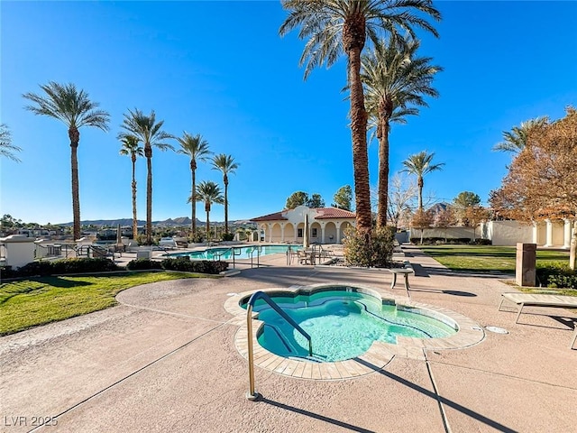 view of swimming pool featuring a patio