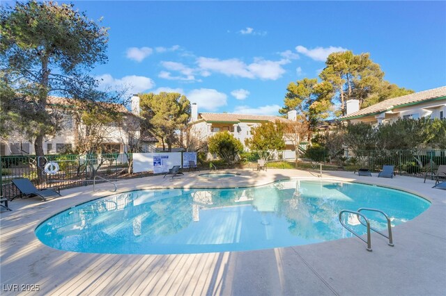 view of swimming pool with a patio area