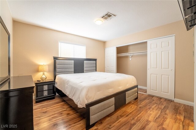 bedroom featuring light hardwood / wood-style floors and a closet