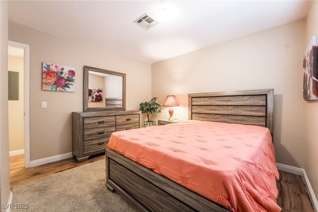 bedroom with hardwood / wood-style floors