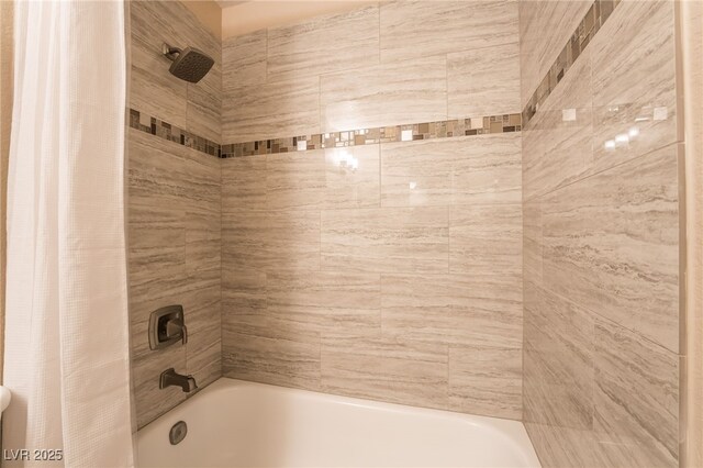 bathroom with shower / tub combo with curtain