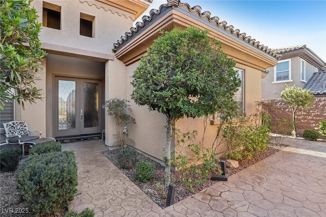 entrance to property featuring french doors