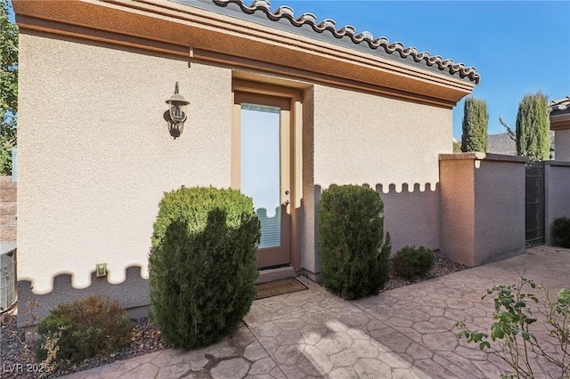 property entrance with a patio