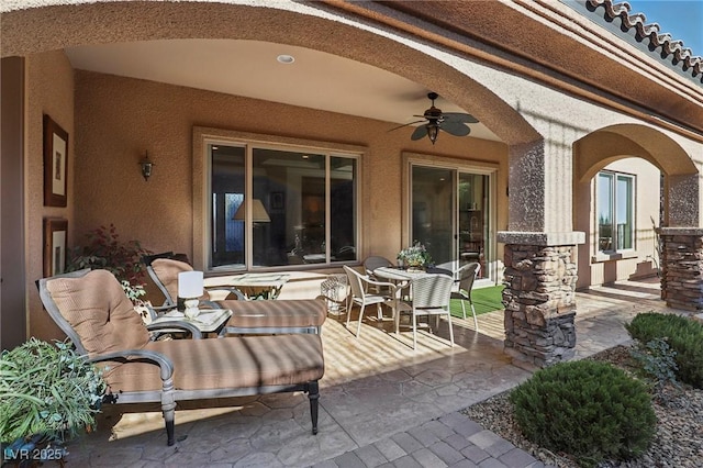 view of patio featuring ceiling fan