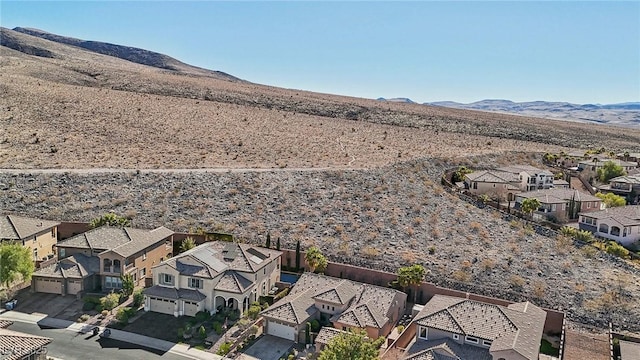 birds eye view of property featuring a mountain view