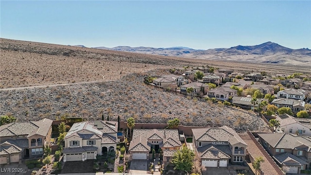 birds eye view of property featuring a mountain view