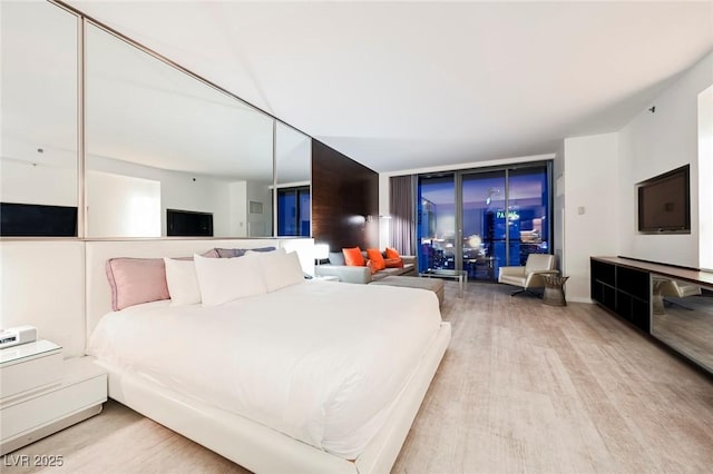 bedroom featuring light wood-type flooring