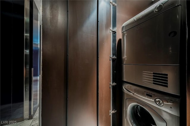 laundry room featuring stacked washer and dryer