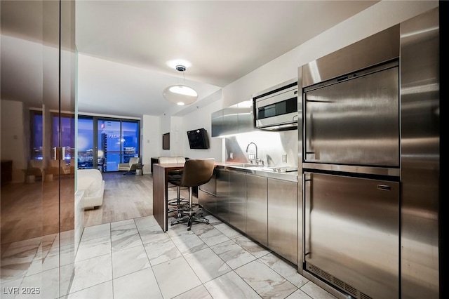 kitchen featuring sink and refrigerator