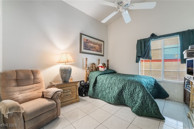 bedroom featuring ceiling fan, vaulted ceiling, and light tile patterned floors