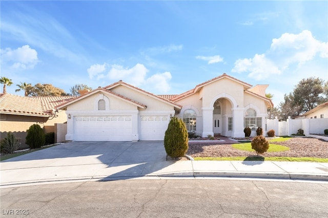 mediterranean / spanish-style home featuring a garage