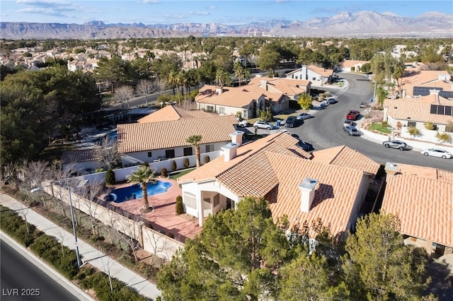 birds eye view of property with a mountain view