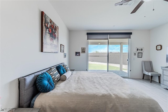 bedroom with ceiling fan and access to outside