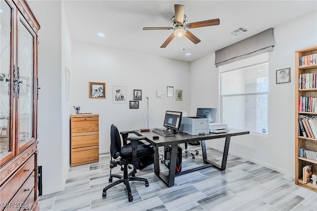 office area with ceiling fan