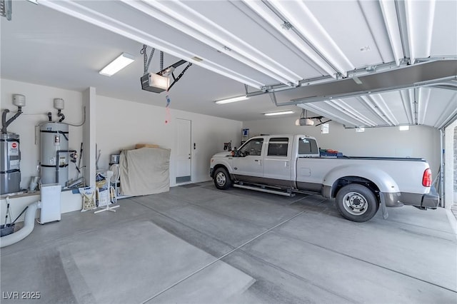 garage with a garage door opener and secured water heater