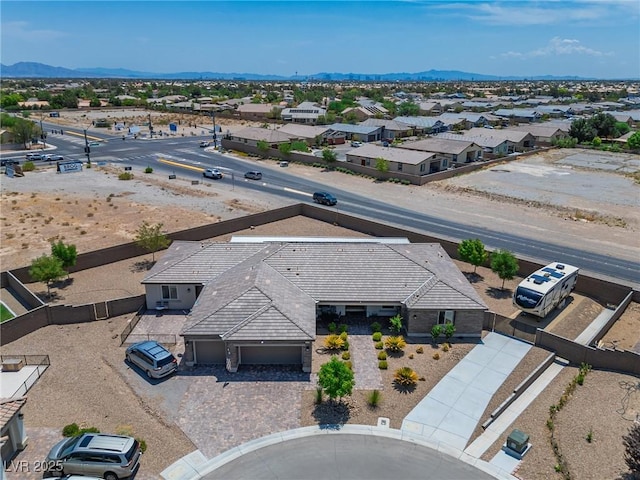 birds eye view of property featuring a mountain view