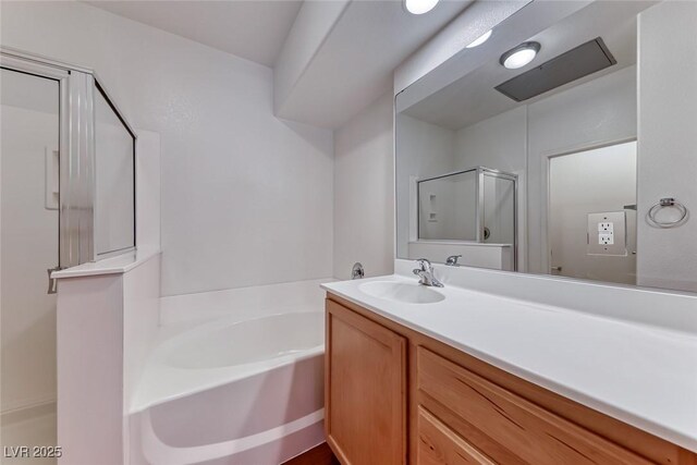 bathroom with separate shower and tub and vanity