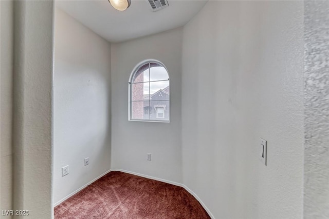 empty room featuring carpet flooring