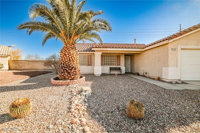 ranch-style home with a garage