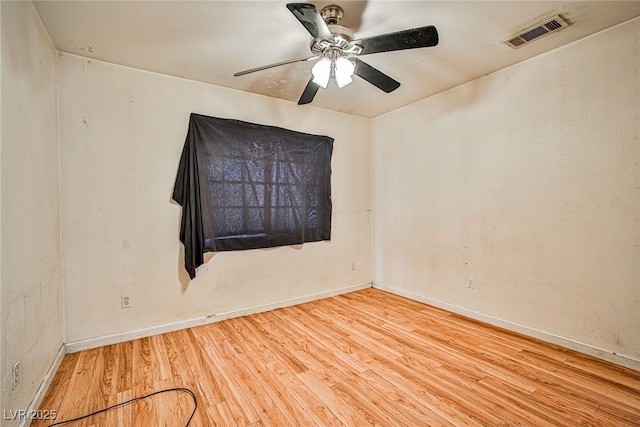 empty room featuring ceiling fan and wood-type flooring