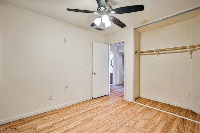 unfurnished bedroom with ceiling fan, light hardwood / wood-style floors, and a closet