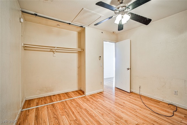 unfurnished bedroom featuring ceiling fan, a closet, and light hardwood / wood-style floors