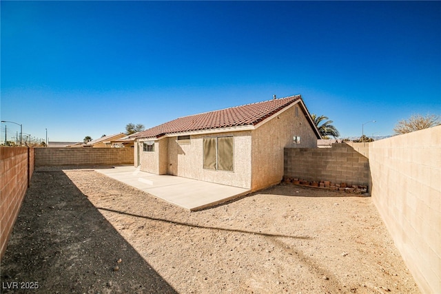 rear view of house with a patio