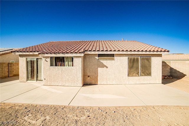 rear view of property featuring a patio