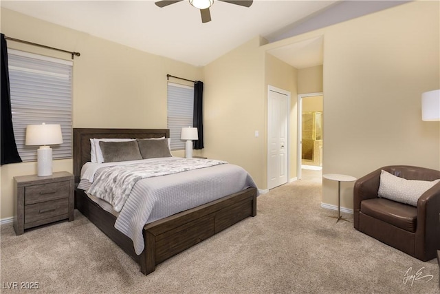 carpeted bedroom with lofted ceiling, ceiling fan, and connected bathroom