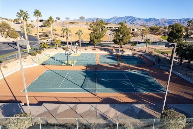 view of sport court featuring basketball court and a mountain view