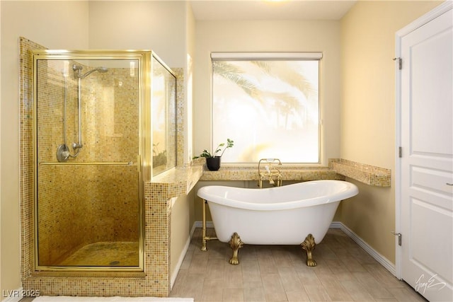 bathroom featuring separate shower and tub