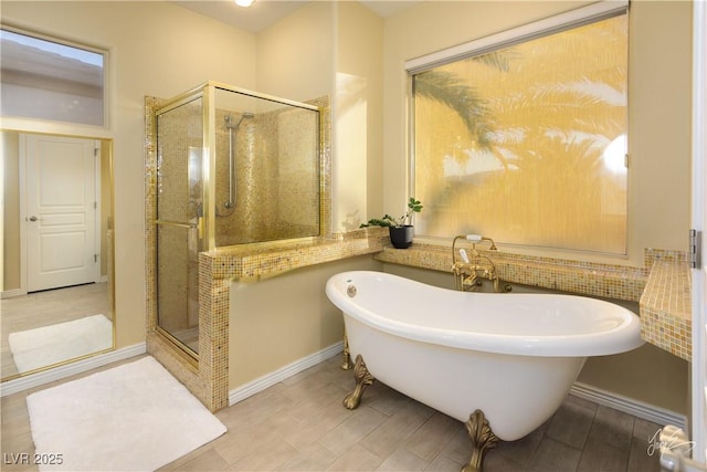 bathroom featuring separate shower and tub