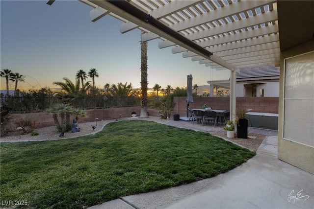 yard at dusk with a patio and a pergola