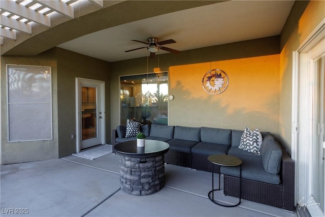 view of patio featuring ceiling fan, a pergola, and an outdoor living space