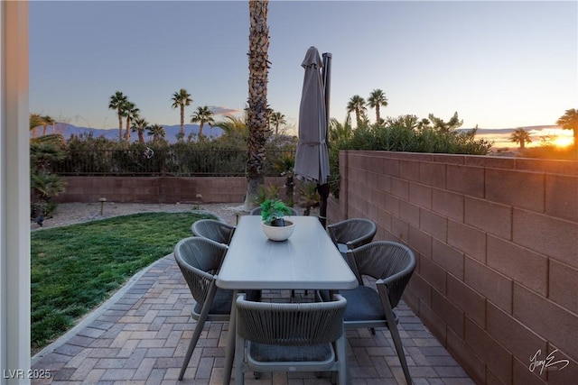 view of patio terrace at dusk