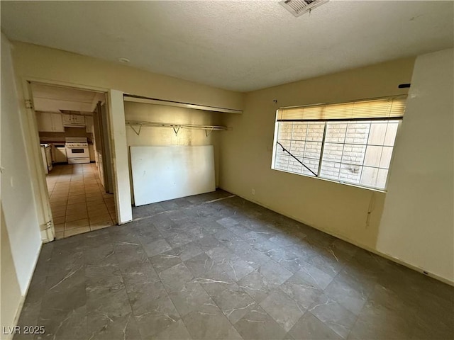 unfurnished bedroom featuring a closet