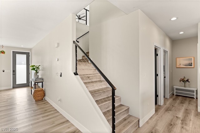 stairway with wood-type flooring