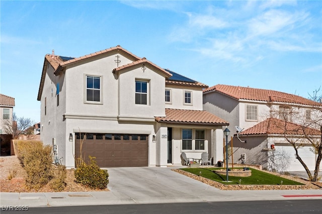 mediterranean / spanish-style home featuring a garage