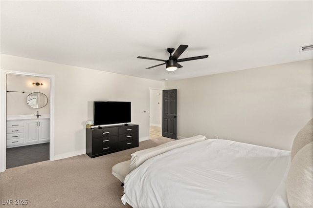 carpeted bedroom with ceiling fan and connected bathroom