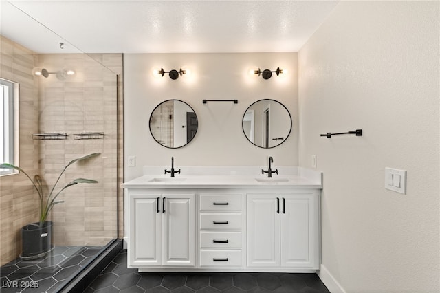 bathroom with vanity, an enclosed shower, and tile patterned flooring