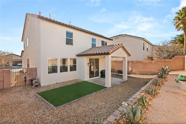 back of house featuring a patio area