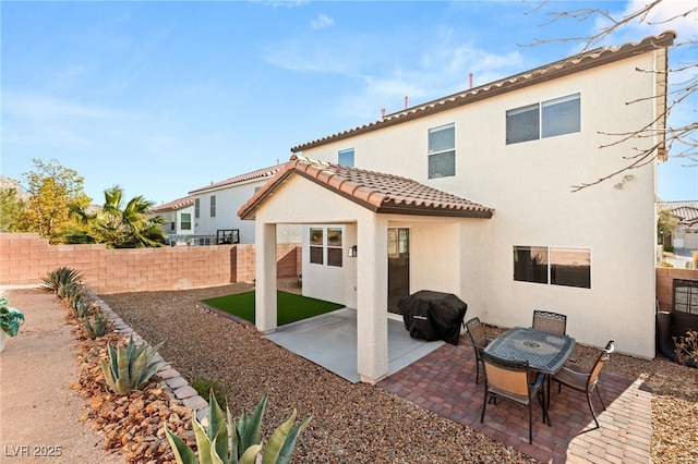 rear view of house featuring a patio area