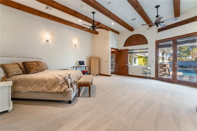 carpeted bedroom with ceiling fan, beamed ceiling, and access to exterior