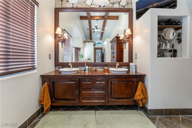 bathroom featuring ceiling fan, tile patterned floors, vaulted ceiling with beams, and vanity