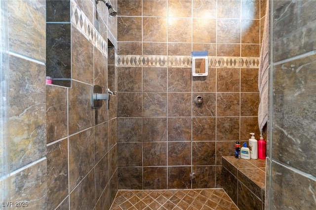 bathroom with tiled shower