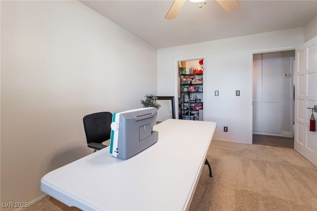 carpeted office with ceiling fan