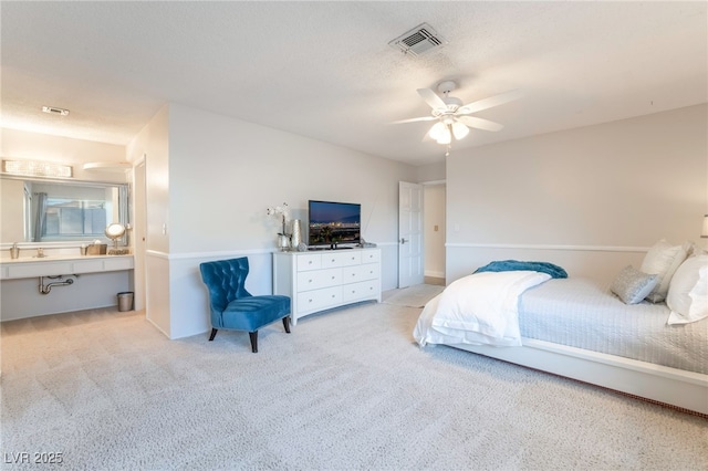 bedroom featuring light carpet and ceiling fan